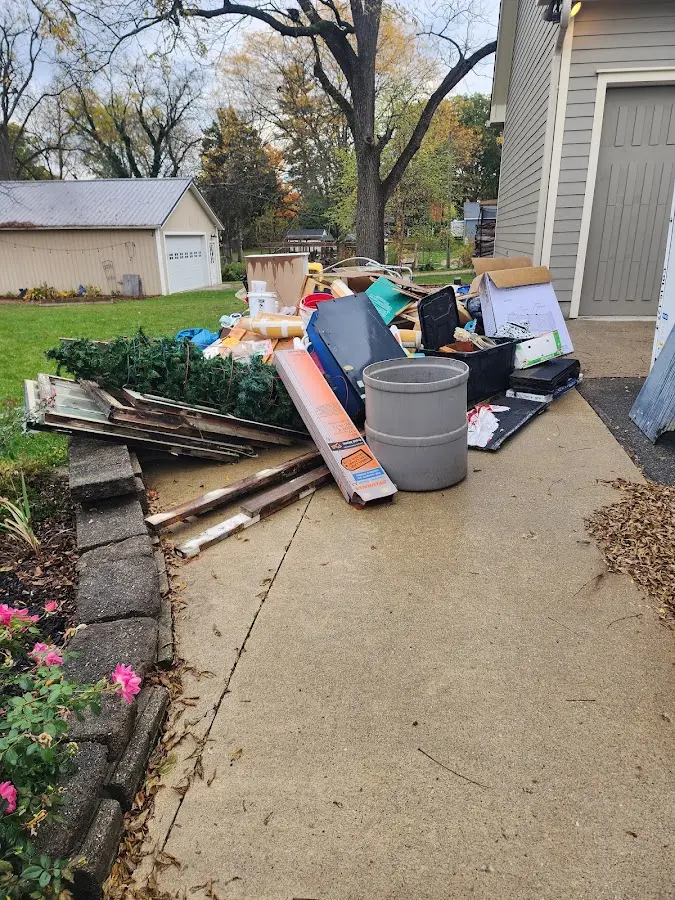 Dumpster being loaded with debris for 3 Yard Dumpster Rental in Lakeland Village